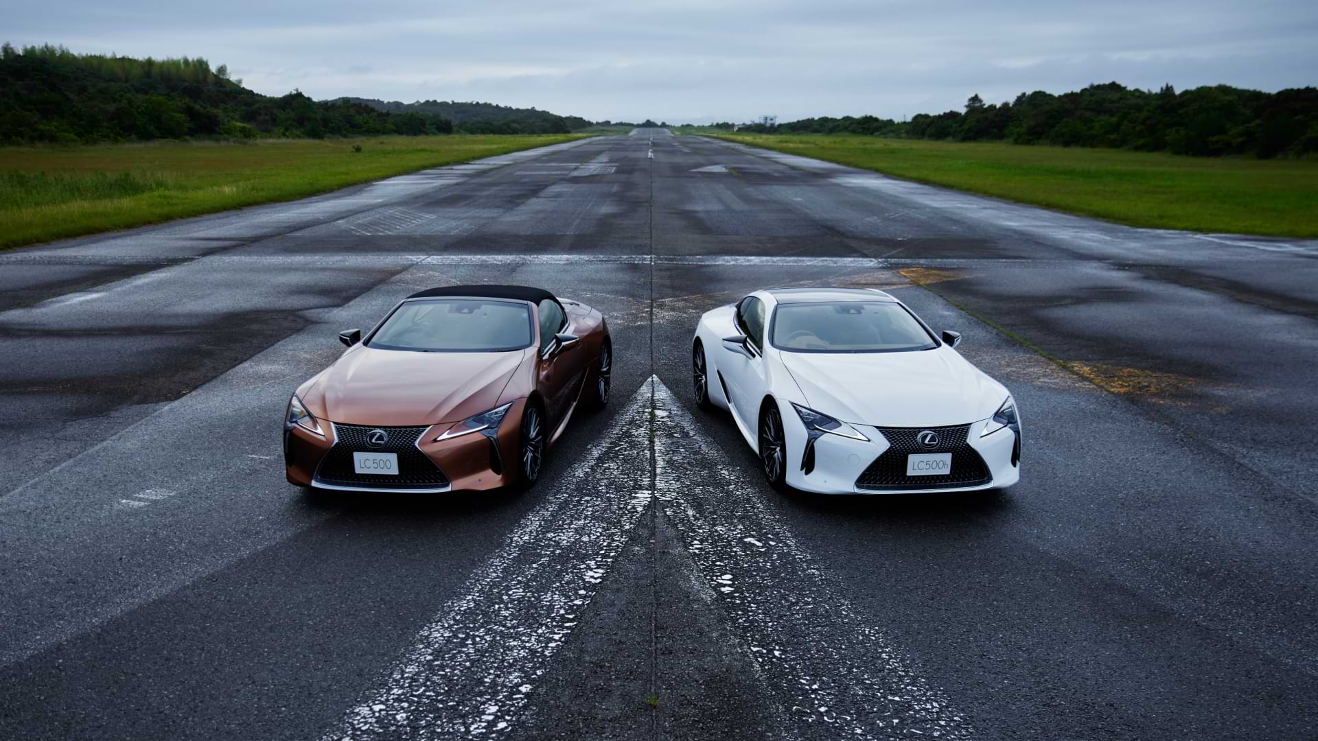 The LC and LC Convertible sit parallel on a race track.