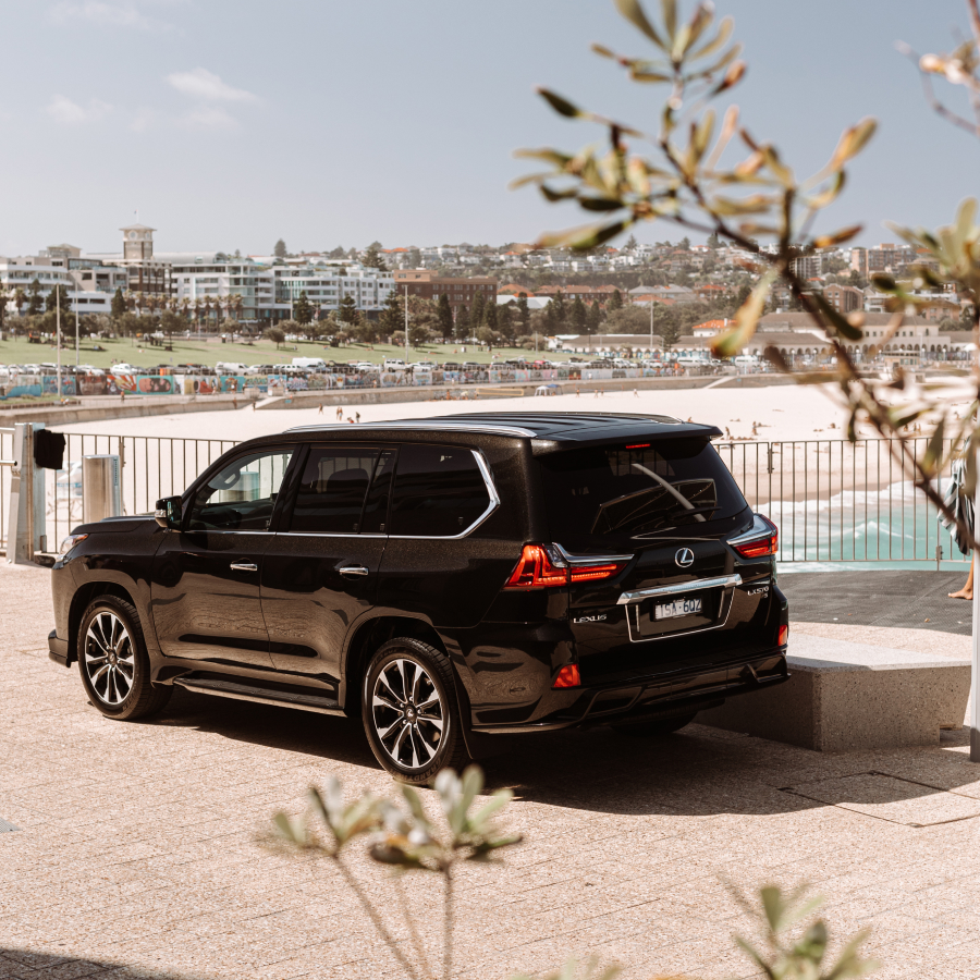 2021 Lexus LX 570 S parked at a beach, facing away.