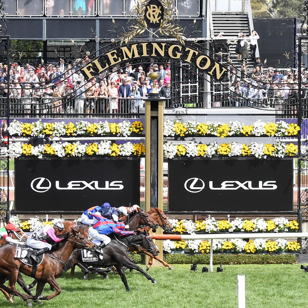 Horses racing past the finish line at Flemington Racecourse during the Lexus Melbourne Cup.