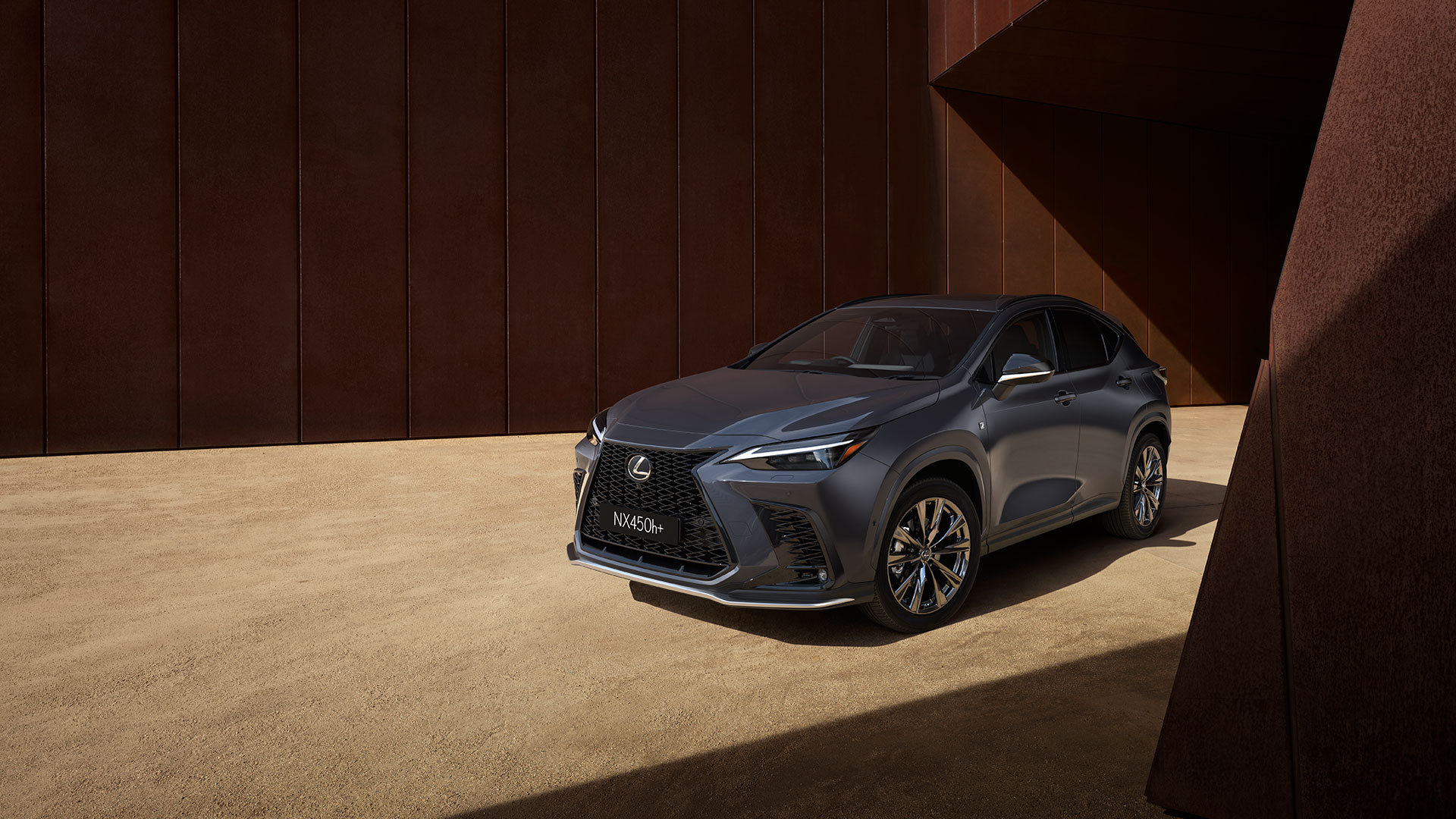 A black Lexus NX parked on a gravel road