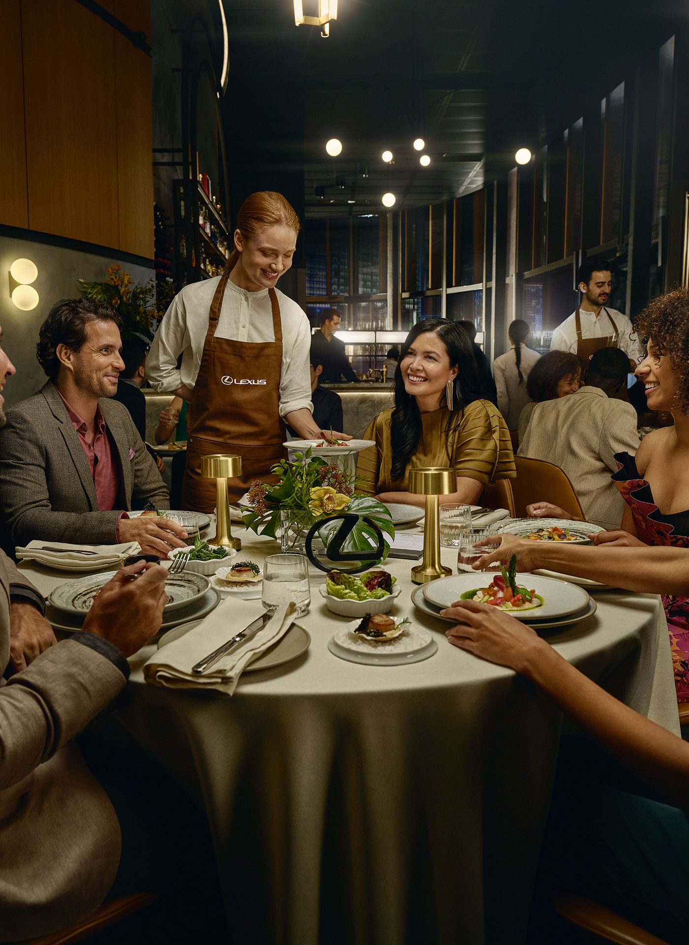 A group of friends dining at a Lexus Encore partner restaurant